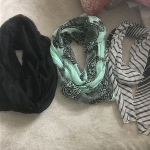 A bundle of three scarfs